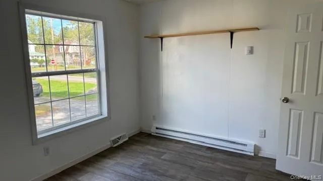 a white toilet and tub sitting next to a bathroom sink