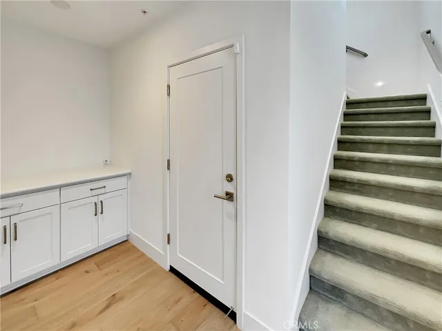 a view of an entryway with wooden floor