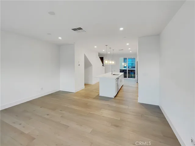 a view of a kitchen with a sink