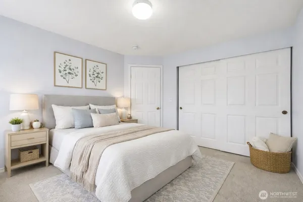 a bedroom with a bed and a couch