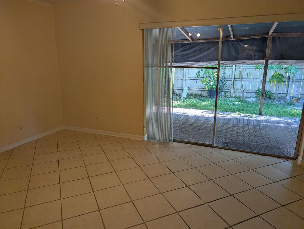 7502 Northwest 44th Court, Unit B Coral Springs, FL 33065 - Photo 6 of 15 a view of a room with sliding glass door