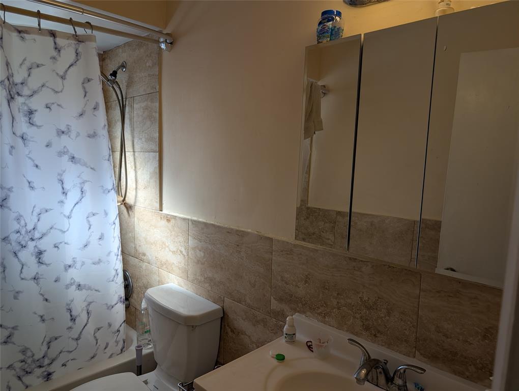 7502 Northwest 44th Court, Unit B Coral Springs, FL 33065 - Photo 10 of 15 a bathroom with a shower and a toilet