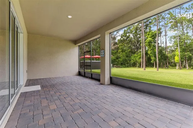 a view of a room with wooden floor and fence