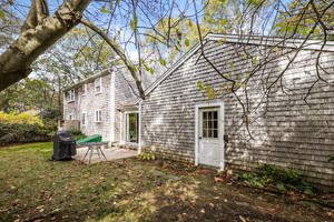 380 Jones Road Marstons Mills, MA 02648 - Photo 3 of 33 a view of a house with backyard and a tree