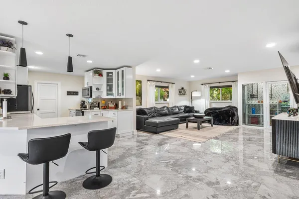 a kitchen with a sink cabinets and window