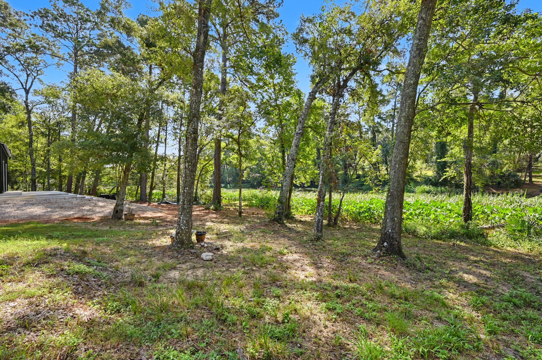 13501 Fultz Road Conroe, TX 77304 - Photo 27 of 30 Enjoy serene waterfront views, the peace and quiet of the property, and access to a Lake Magnolia located in your OWN backyard!