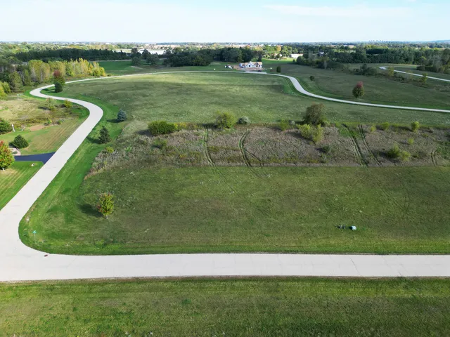 a view of a golf course with a lake