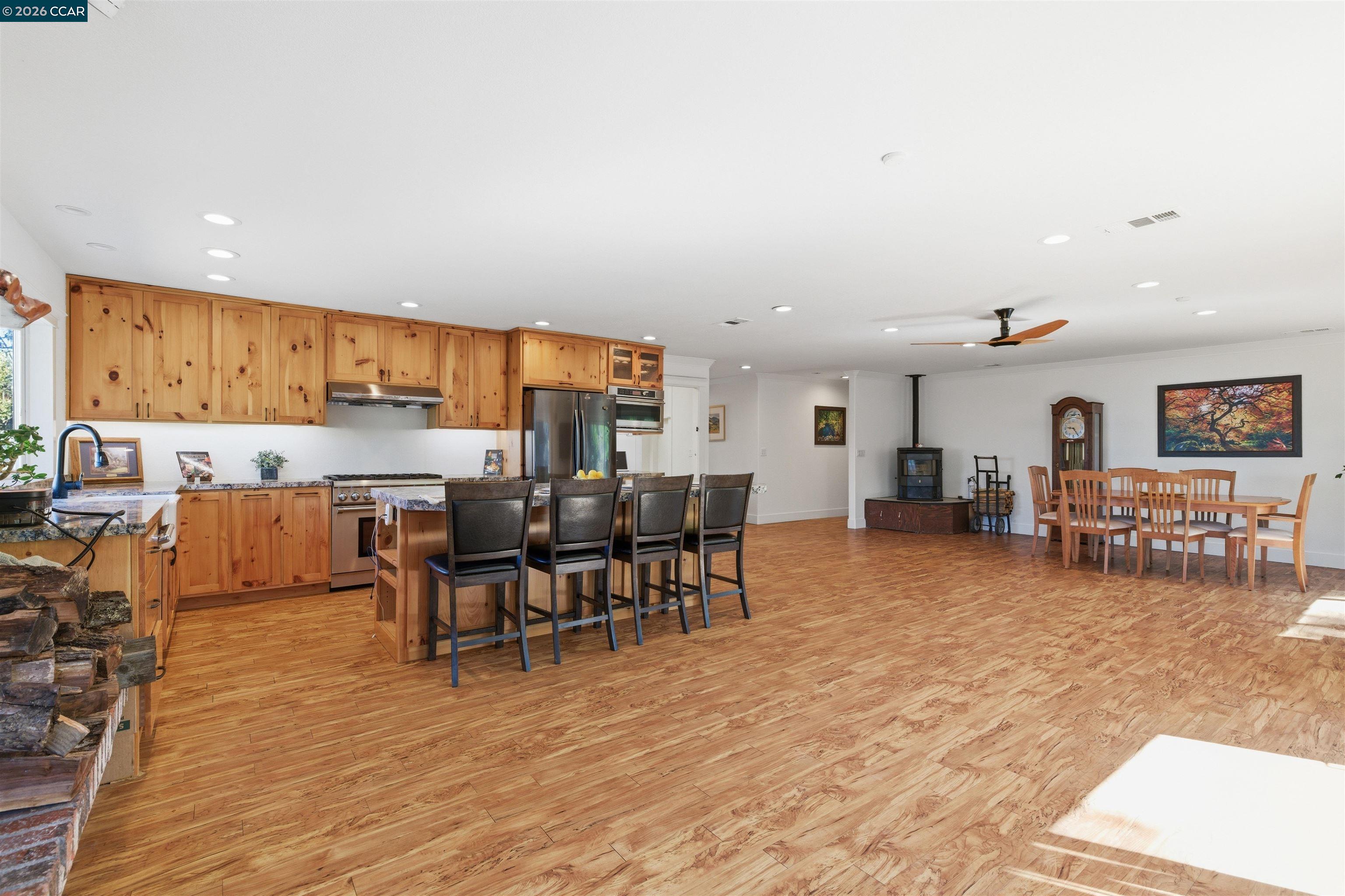 9530 Morgan Territory Road Livermore, CA 94551 - Photo 10 of 55 a living room with lots of furniture and kitchen view