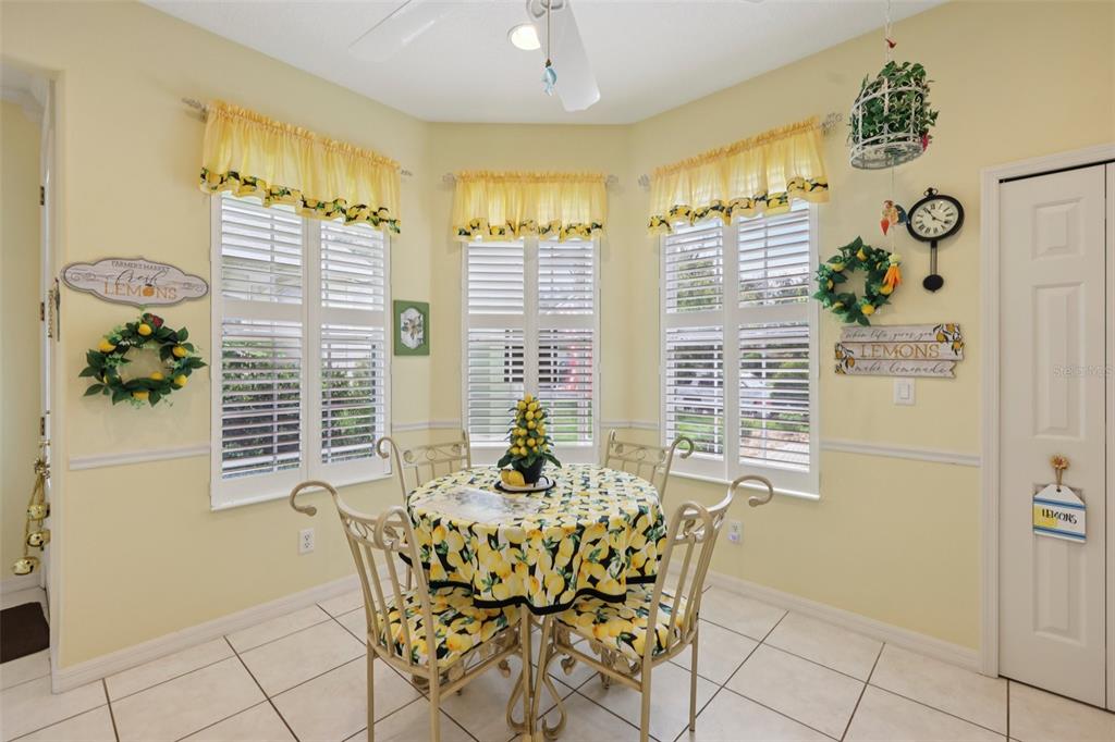 4954 Rainbow Trout Road Tavares, FL 32778 - Photo 15 of 37 a dining room with furniture and window