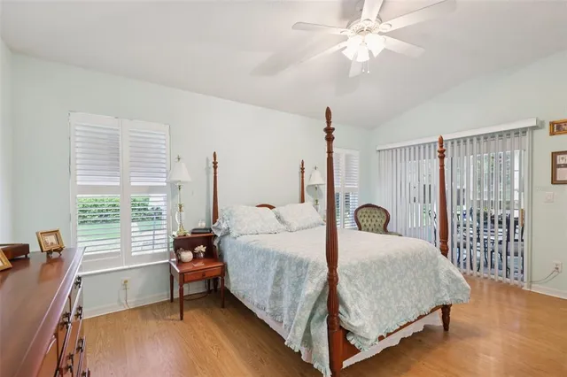 a bed room with a bed and a chandelier
