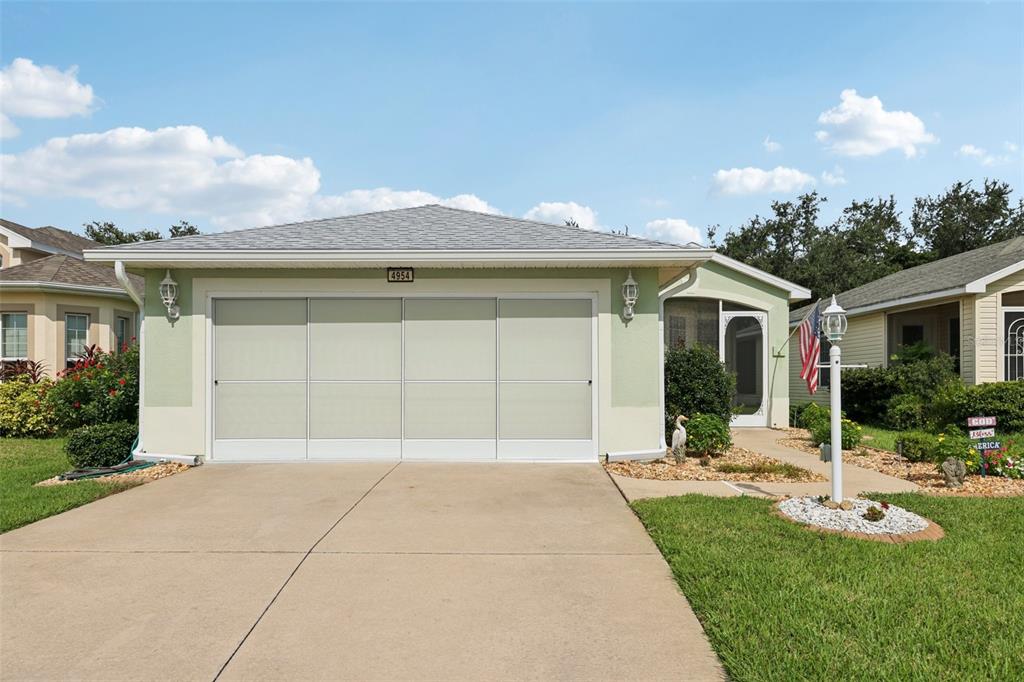 4954 Rainbow Trout Road Tavares, FL 32778 - Photo 3 of 37 a front view of house with yard and green space