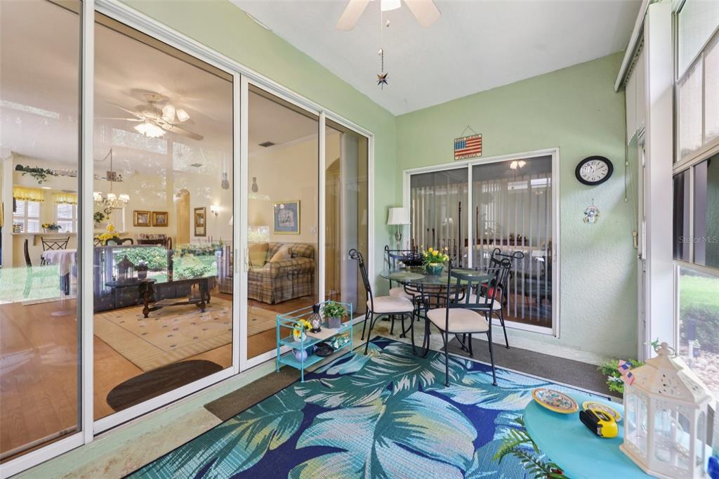 4954 Rainbow Trout Road Tavares, FL 32778 - Photo 31 of 37 a living room with furniture and a large window