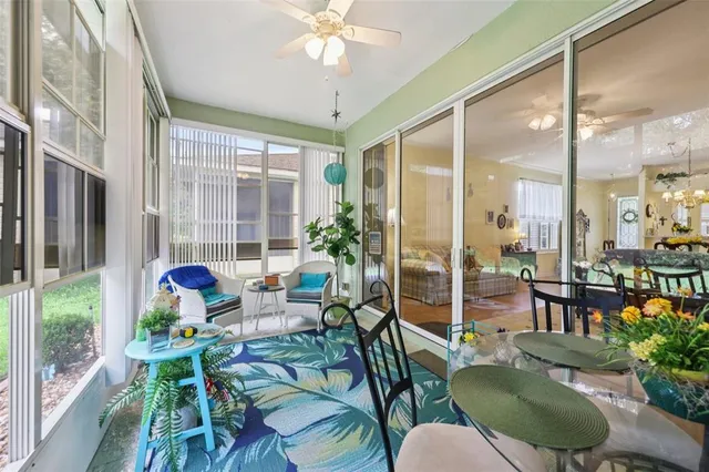 a living room filled with furniture and a large window