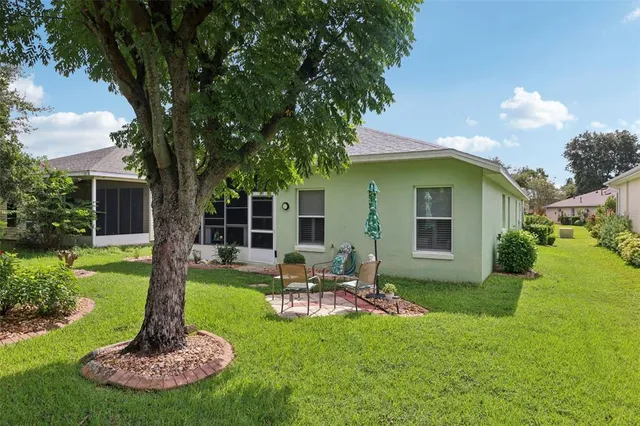 a front view of house with a garden and patio