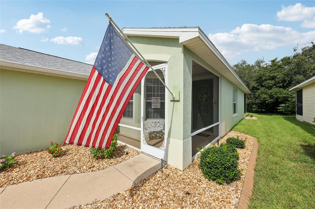 4954 Rainbow Trout Road Tavares, FL 32778 - Photo 5 of 37 a front view of a house with a yard