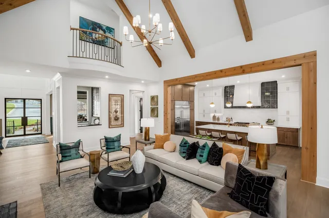 a kitchen with stainless steel appliances a sink stove and refrigerator