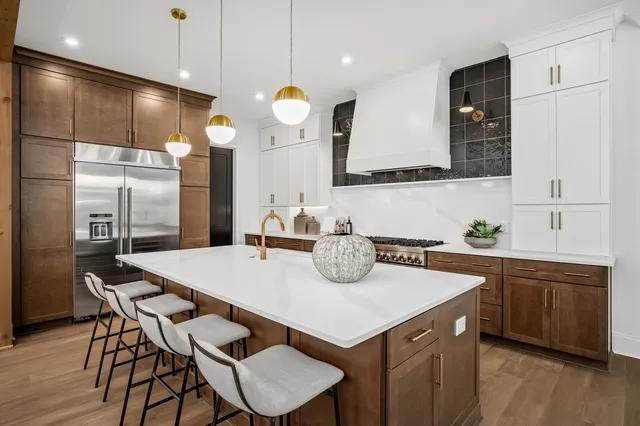 a kitchen with a table and chairs in it