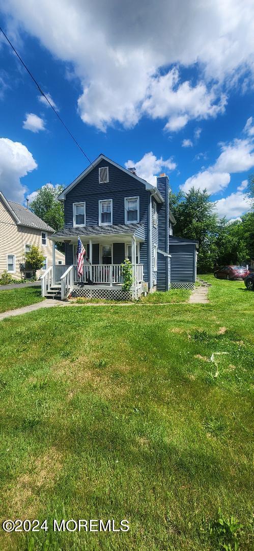 902 Adelphia Road Freehold, NJ 07728 - Photo 1 of 14 a view of a house with a big yard