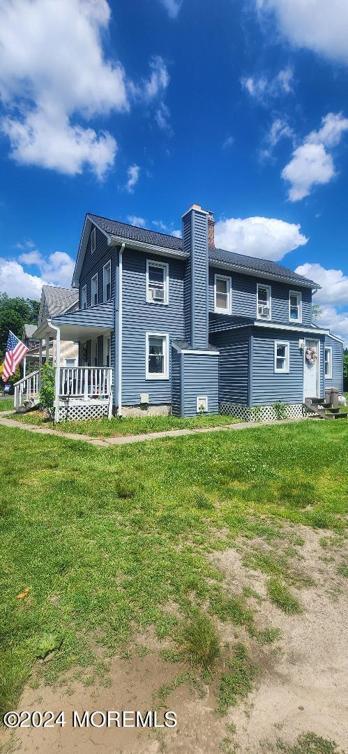 902 Adelphia Road Freehold, NJ 07728 - Photo 3 of 14 a front view of a house with a garden