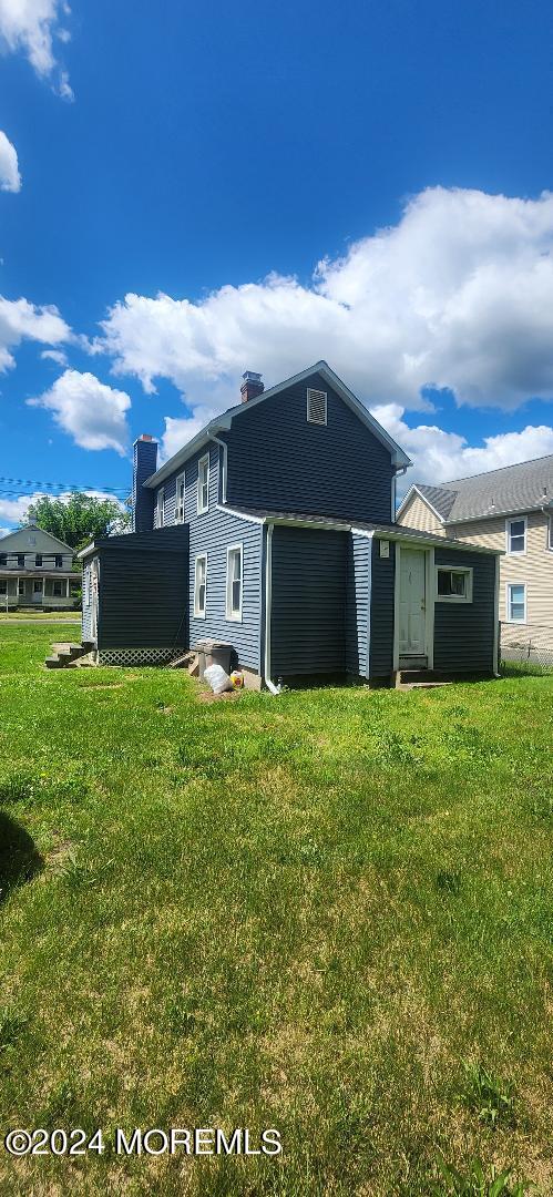 902 Adelphia Road Freehold, NJ 07728 - Photo 4 of 14 a view of a house with a yard