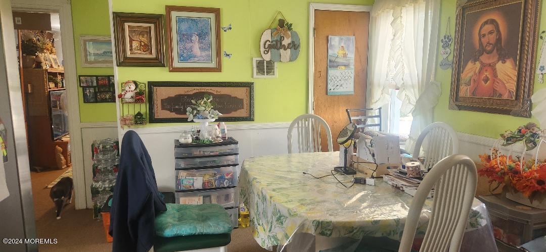 902 Adelphia Road Freehold, NJ 07728 - Photo 8 of 14 a dining room with furniture and wooden floor