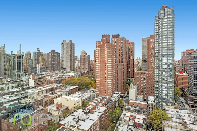 a view of city with tall buildings