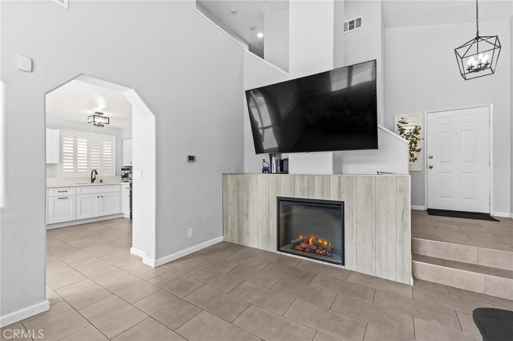 823 Pathfinder Way Corona, CA 92878 - Photo 12 of 59 a view of a livingroom with an empty space and a fireplace