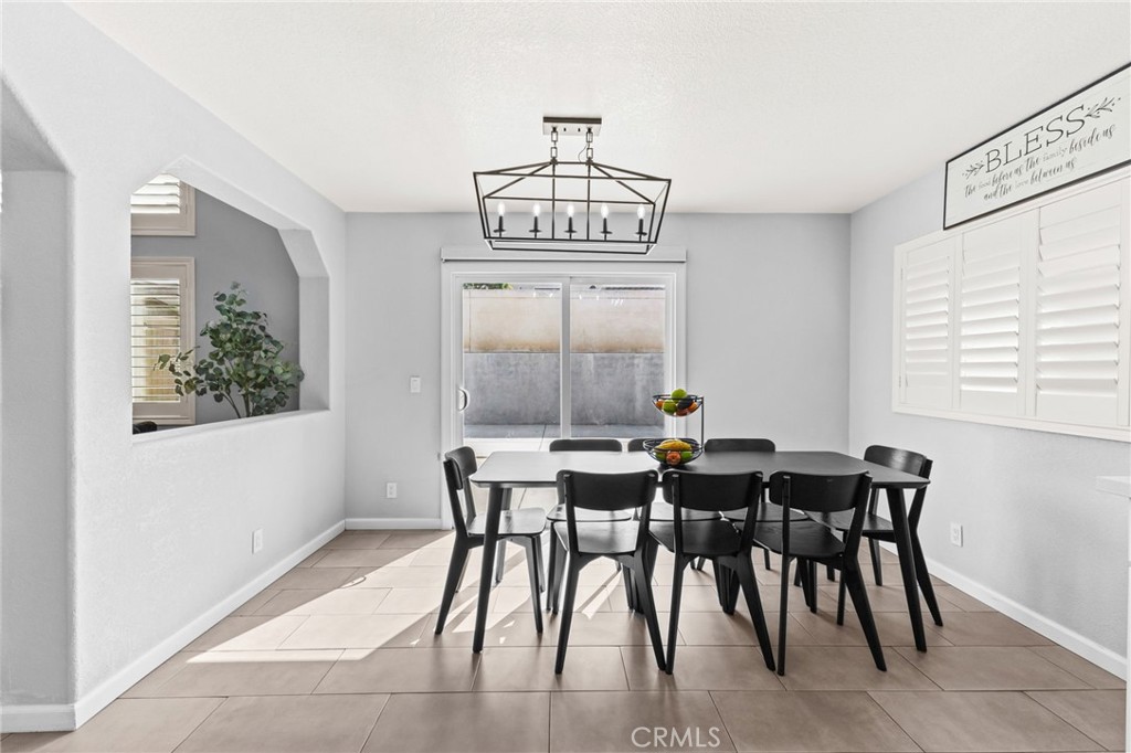 823 Pathfinder Way Corona, CA 92878 - Photo 14 of 59 a view of a dining room with furniture window and outside view