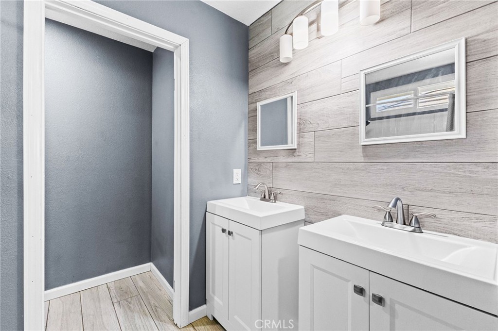 823 Pathfinder Way Corona, CA 92878 - Photo 31 of 59 a bathroom with a sink and a mirror
