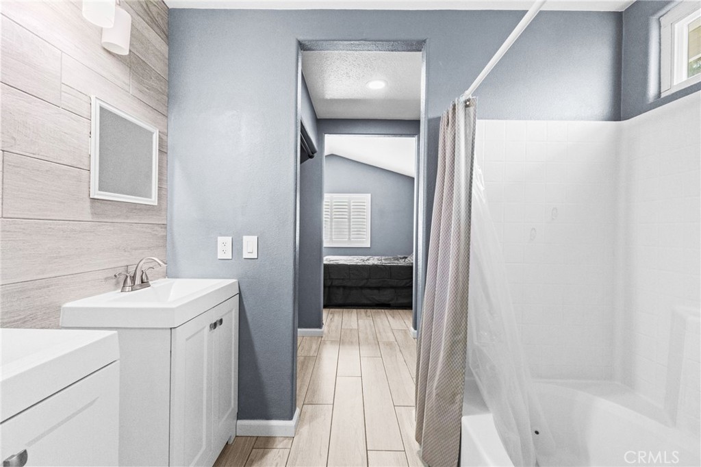 823 Pathfinder Way Corona, CA 92878 - Photo 32 of 59 a en suite bathroom with a sink and mirror