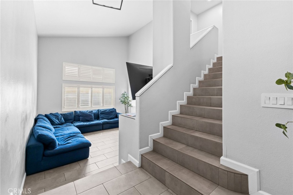823 Pathfinder Way Corona, CA 92878 - Photo 6 of 59 a living room with furniture and stairs