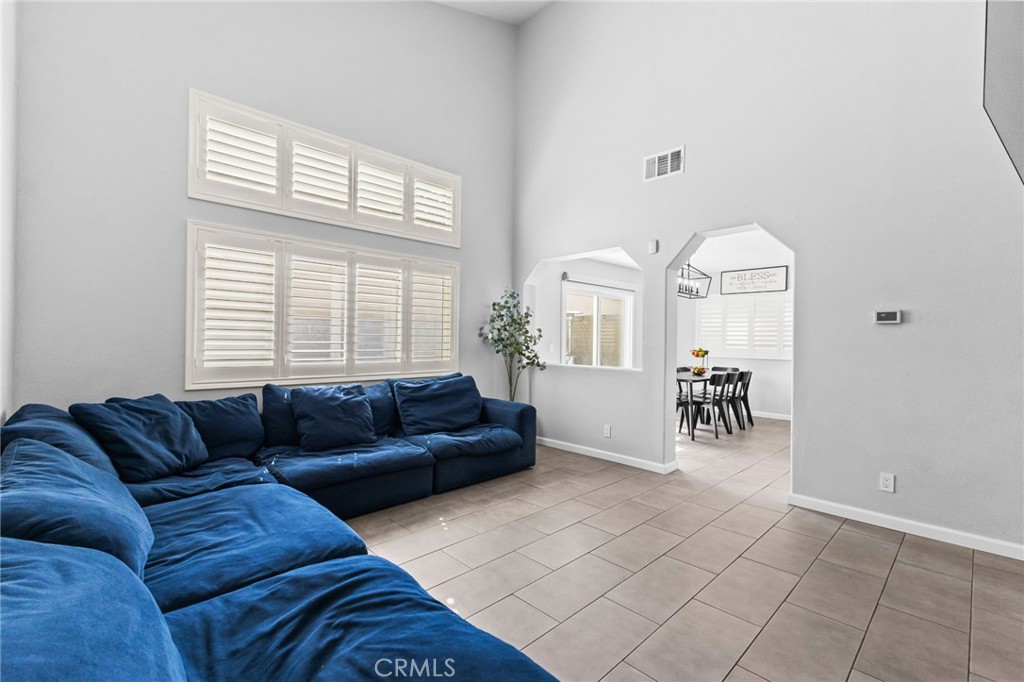 823 Pathfinder Way Corona, CA 92878 - Photo 8 of 59 a living room with furniture and a large window