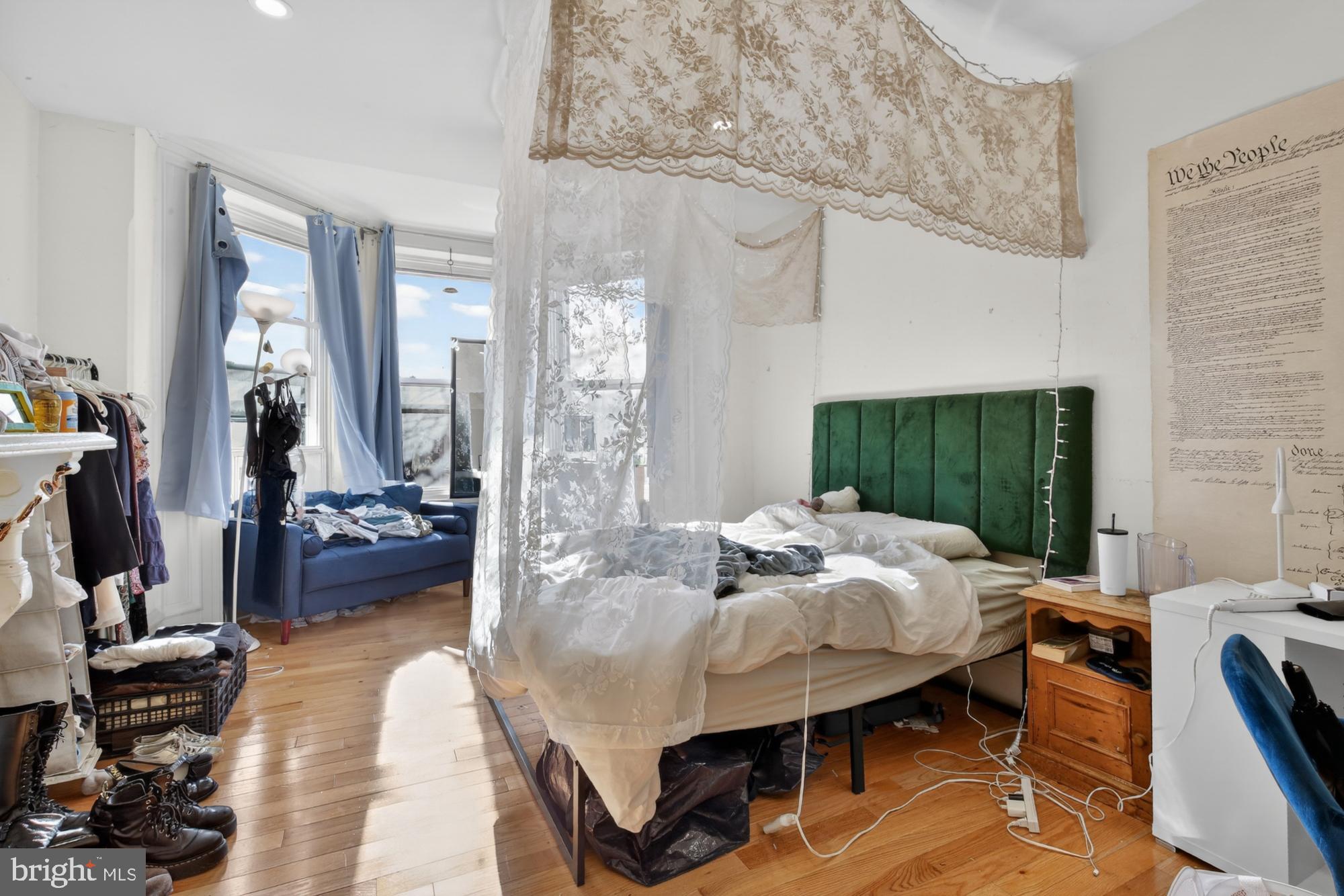 4058 Irving Street Philadelphia, PA 19104 - Photo 11 of 23 a bedroom with furniture and a wooden floor