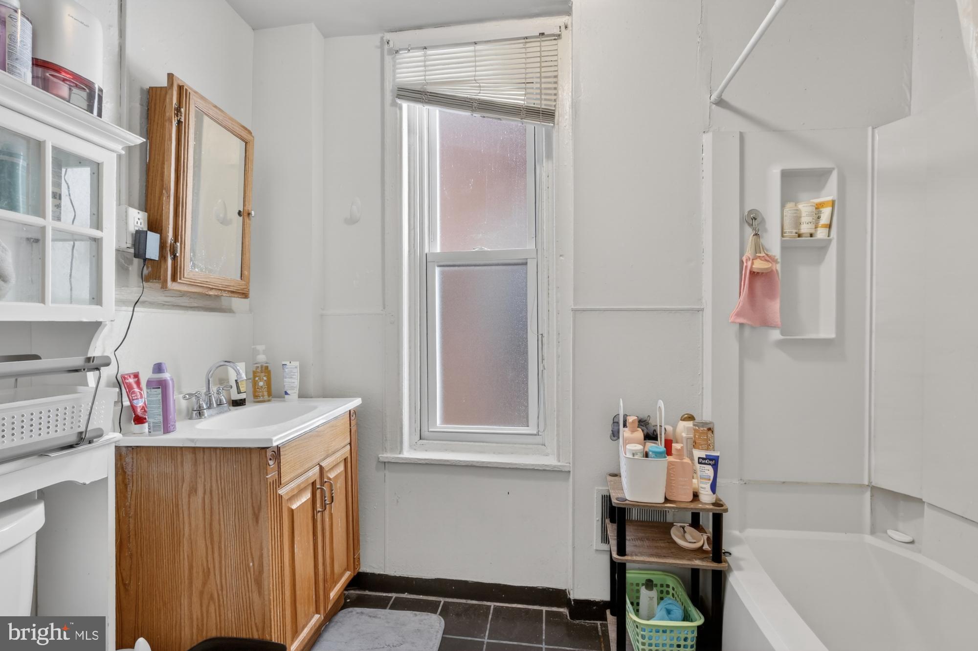 4058 Irving Street Philadelphia, PA 19104 - Photo 12 of 23 a bathroom with a sink and a bathtub