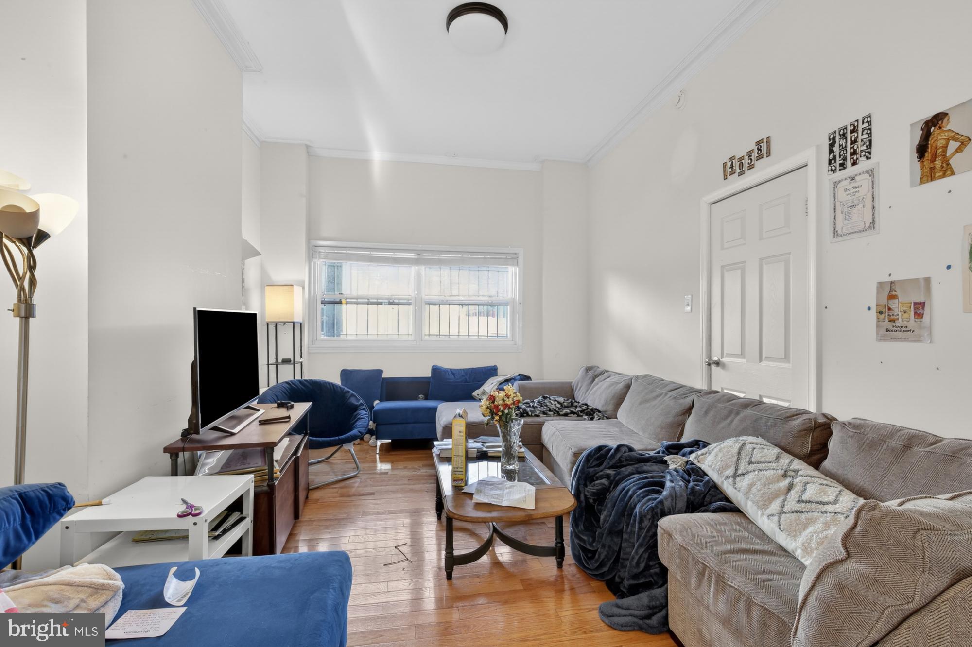 4058 Irving Street Philadelphia, PA 19104 - Photo 2 of 23 a living room with furniture fireplace and a window