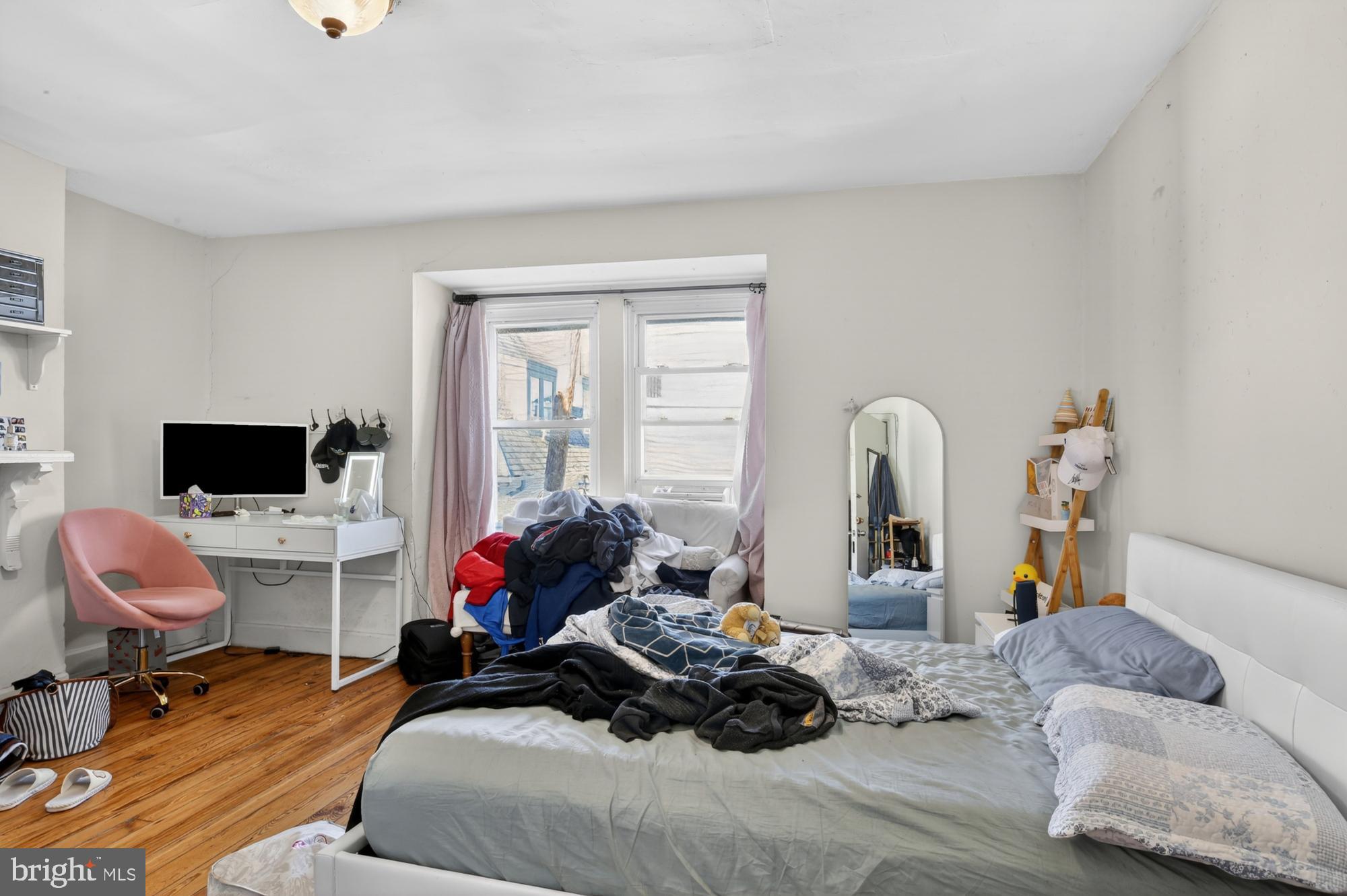 4058 Irving Street Philadelphia, PA 19104 - Photo 21 of 23 a bedroom with furniture and a flat screen tv