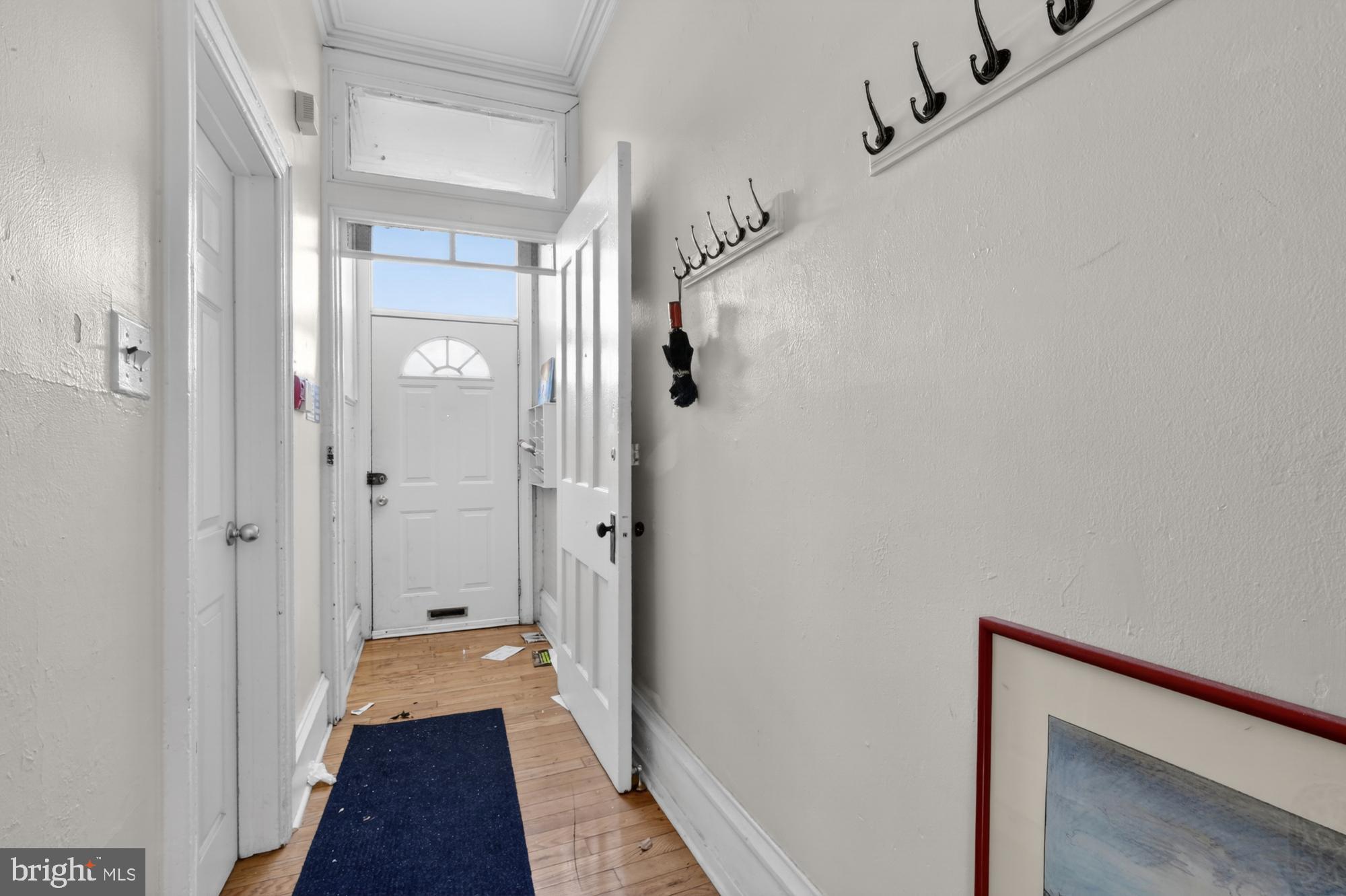 4058 Irving Street Philadelphia, PA 19104 - Photo 3 of 23 a view of a hallway with a wooden floor