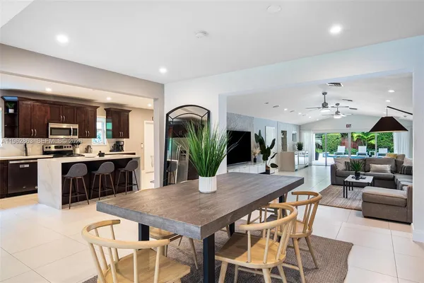 a view of a dining room kitchen with furniture and wooden floor