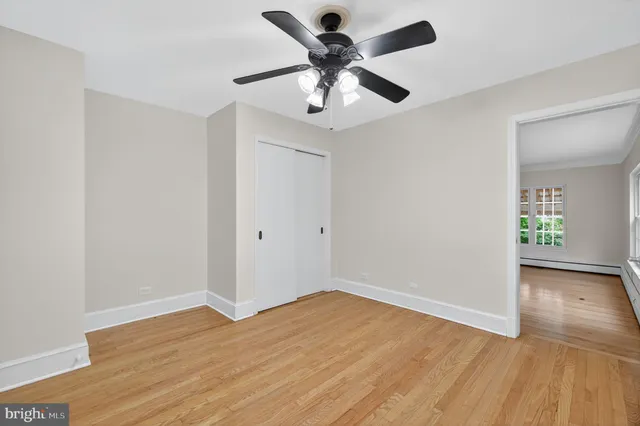 a view of a swimming pool and trees in the background