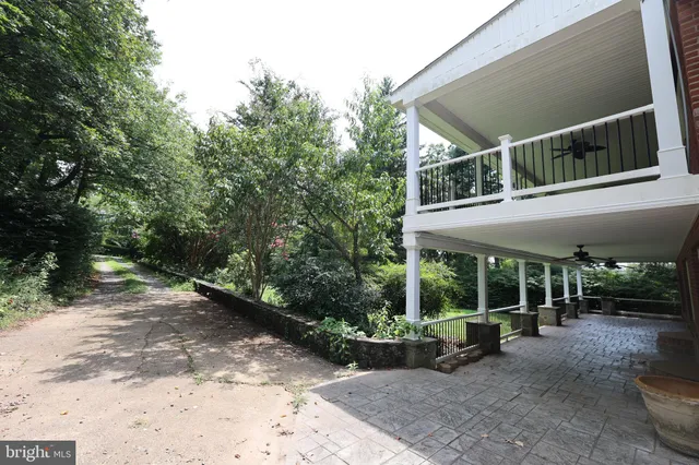 a view of a porch with wooden floor and outdoor seating