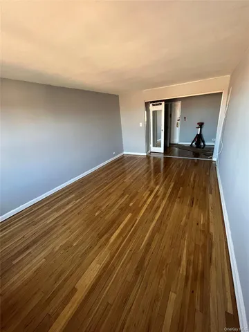 a view of a room with wooden floor and closet