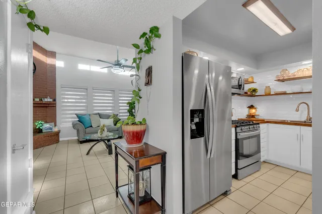 a kitchen with stainless steel appliances granite countertop a sink and a stove