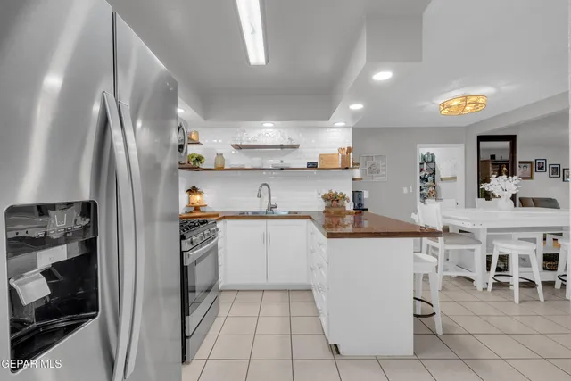 a view of a living room and kitchen