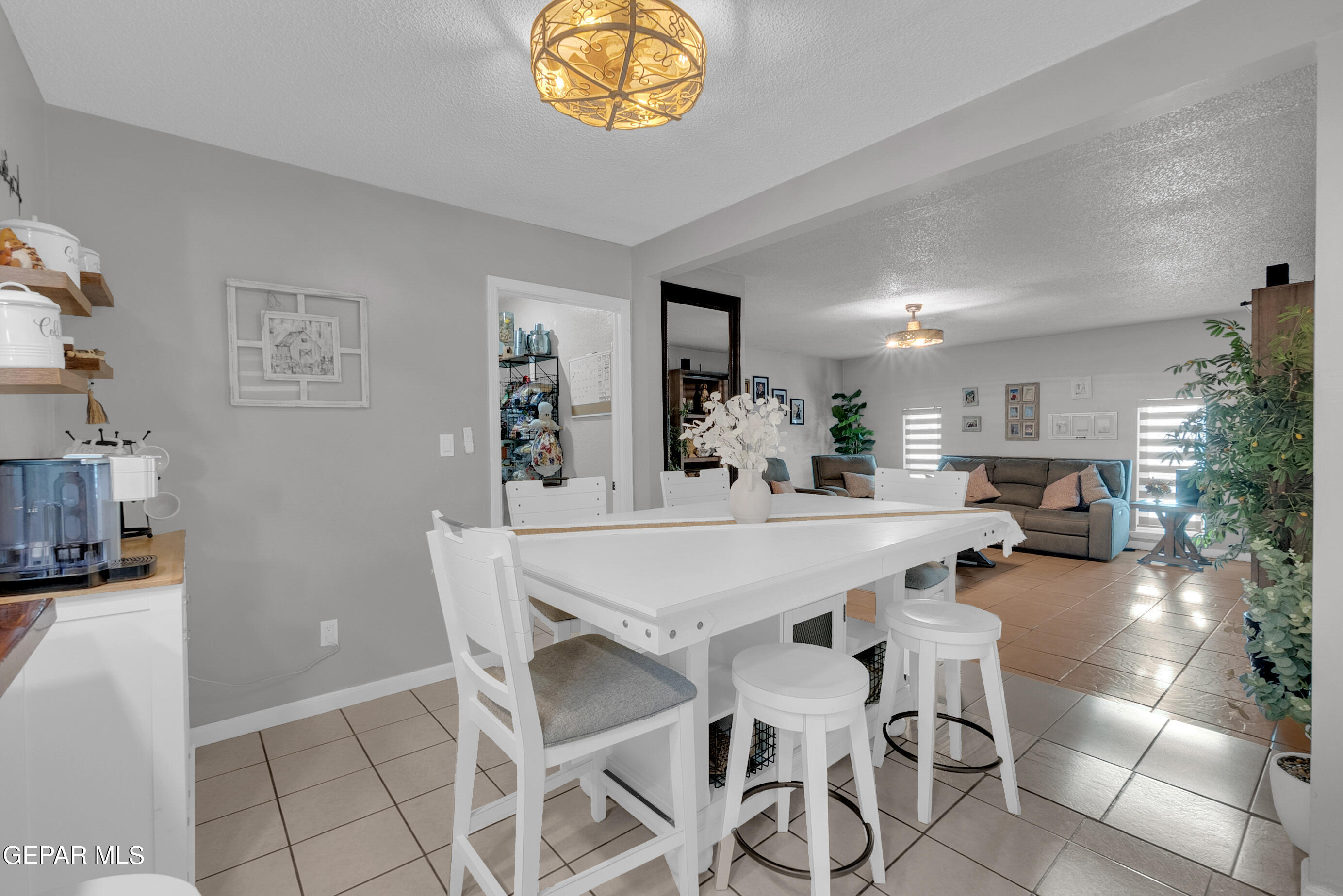 3444 Itasca Street El Paso, TX 79936 - Photo 20 of 88 a view of a dining room with furniture and a chandelier