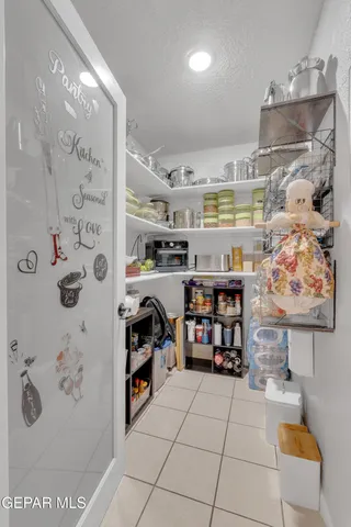 a view of a hallway with closet and a window