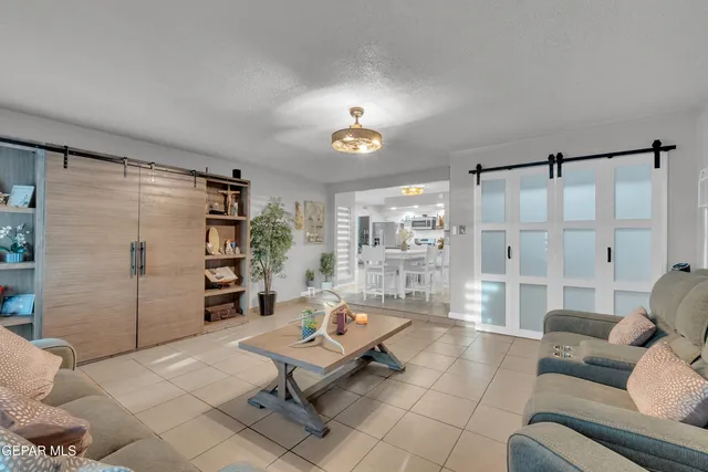 a bedroom with a bed and a table