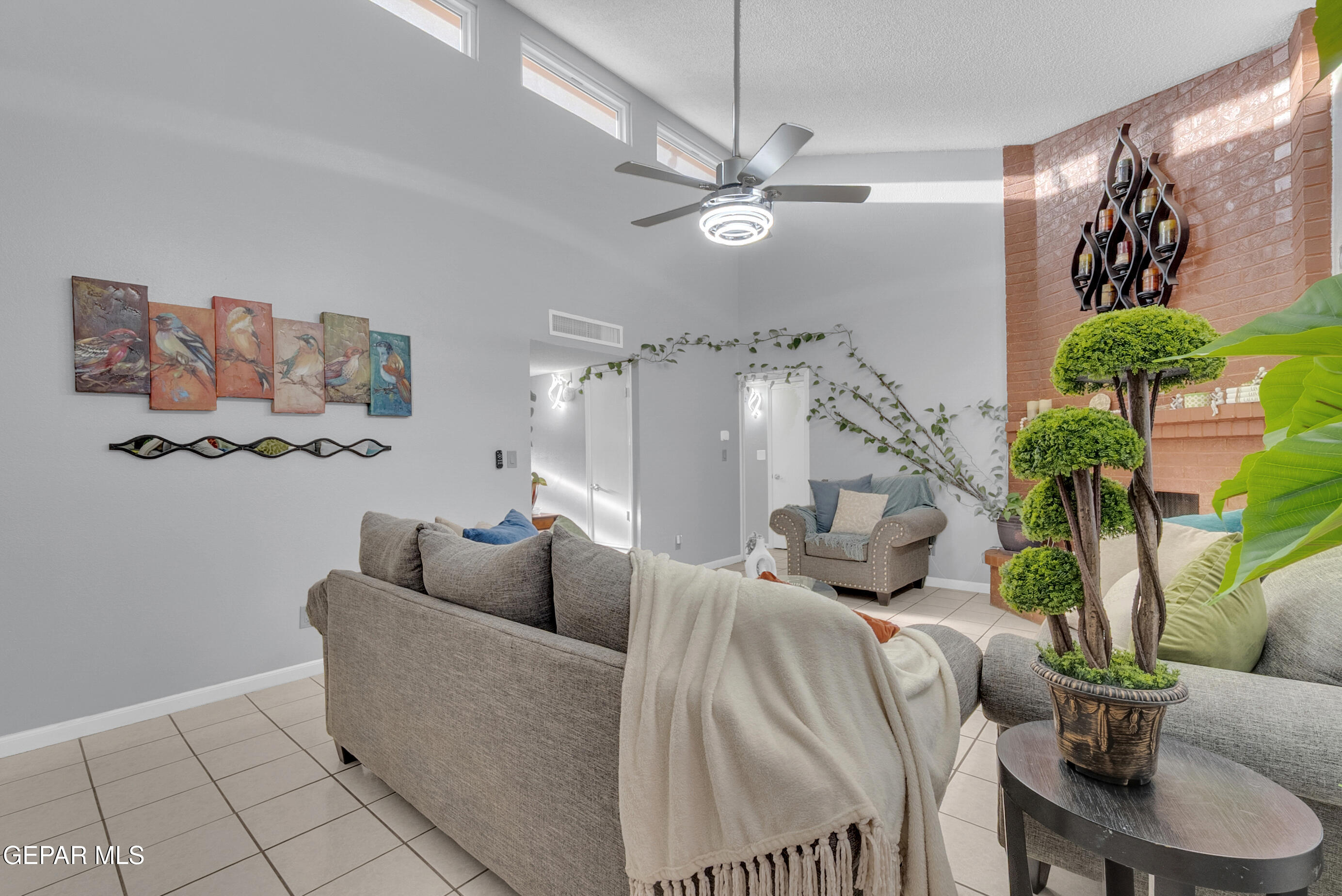3444 Itasca Street El Paso, TX 79936 - Photo 30 of 88 a living room with furniture and a chandelier