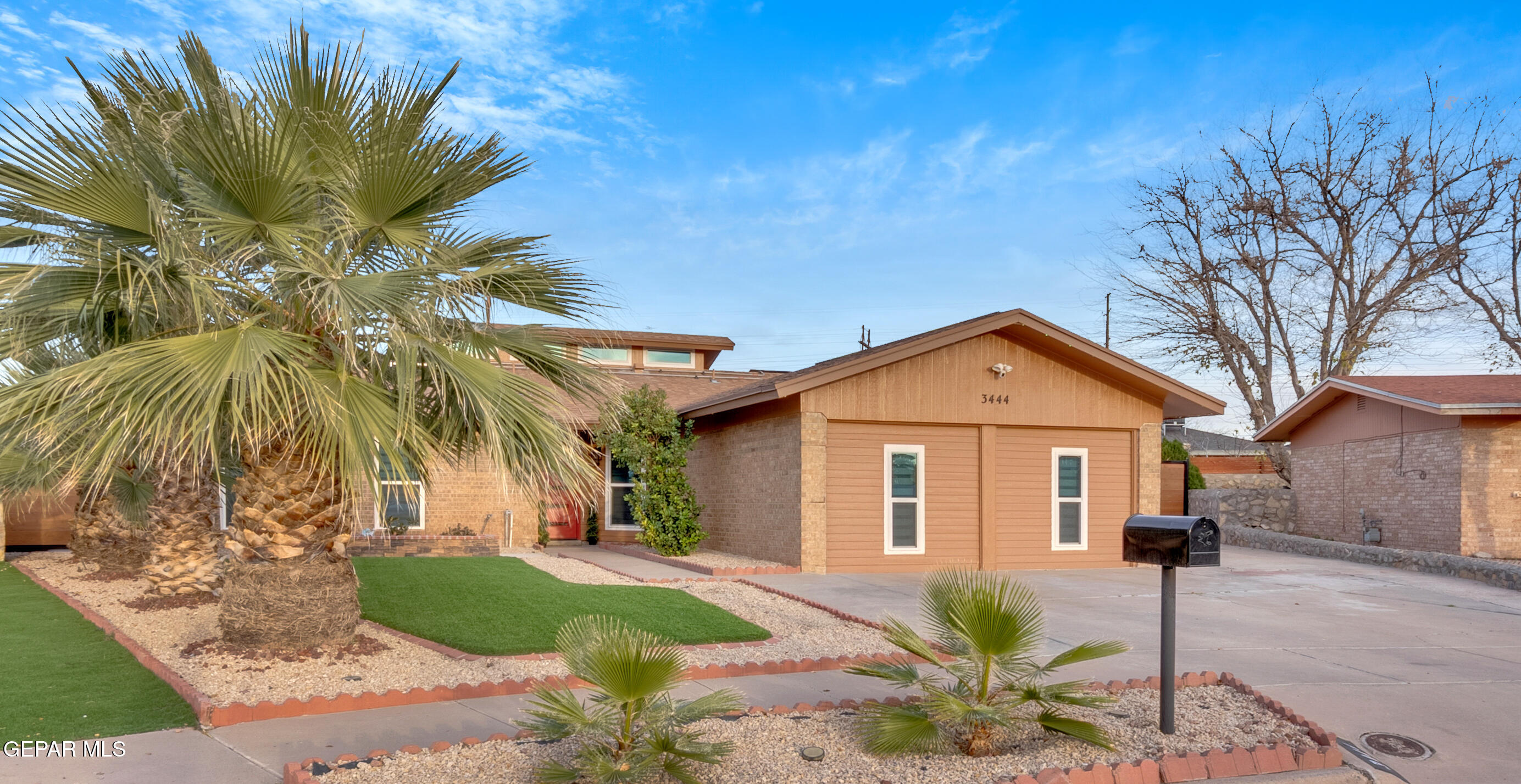 3444 Itasca Street El Paso, TX 79936 - Photo 3 of 88 a front view of a house with a yard and garage