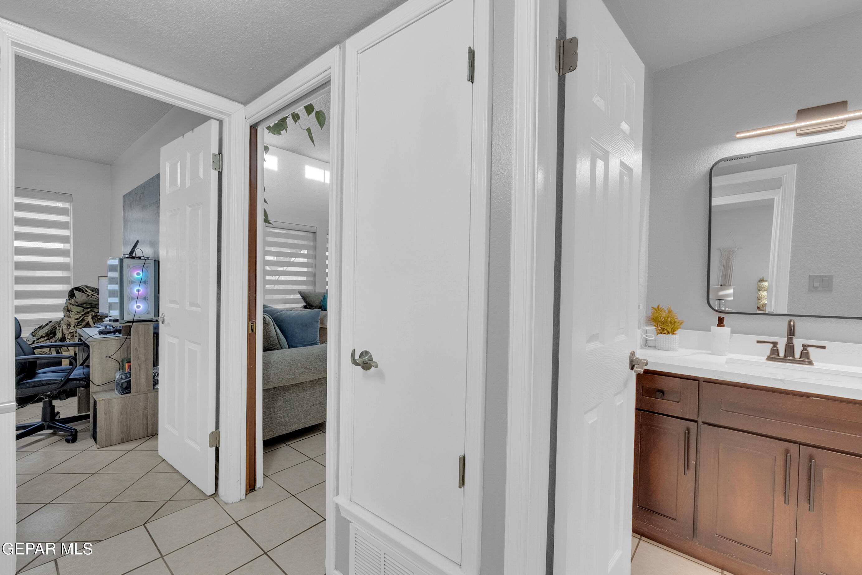 3444 Itasca Street El Paso, TX 79936 - Photo 34 of 88 a en suite bathroom with a double vanity sink and a mirror
