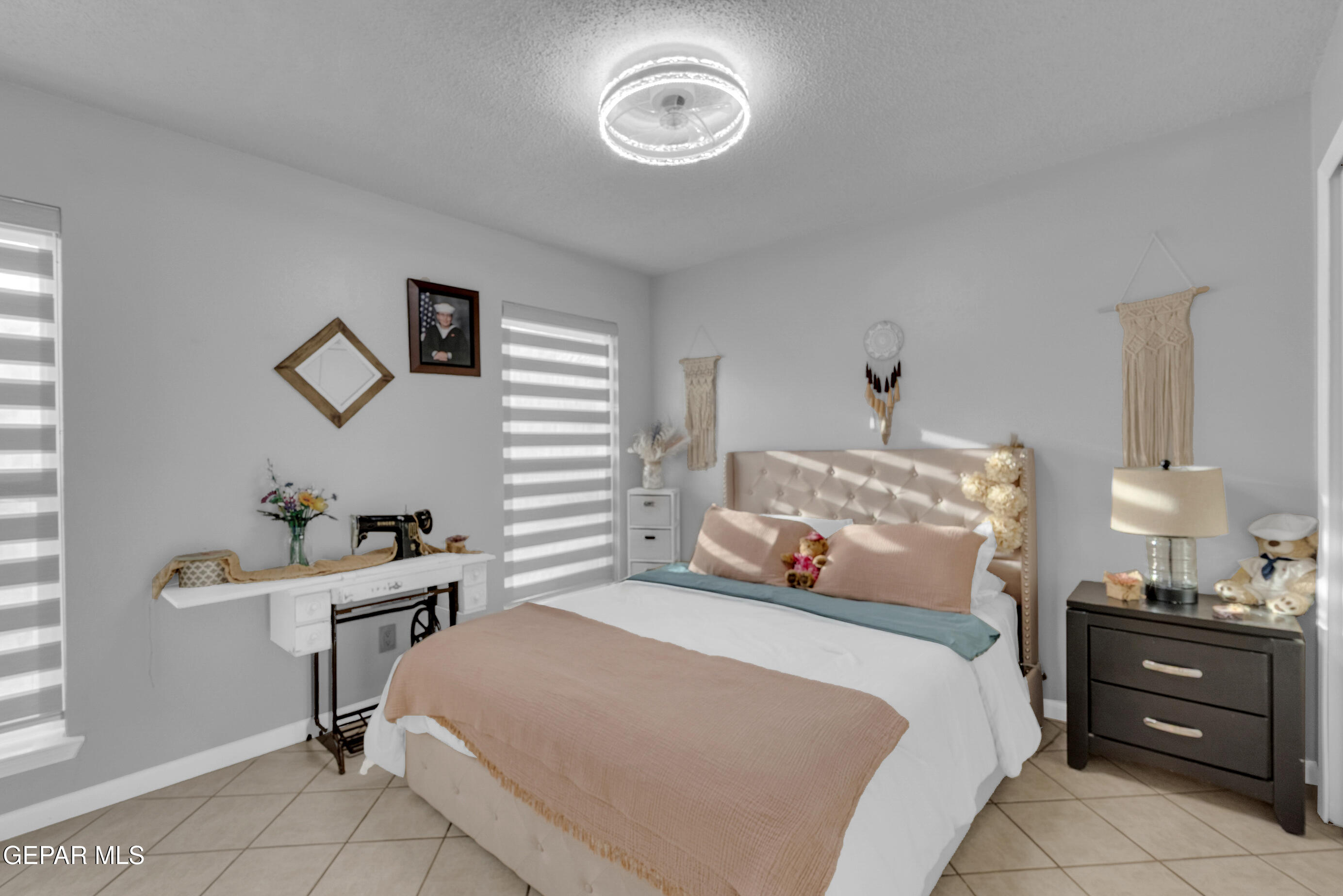 3444 Itasca Street El Paso, TX 79936 - Photo 35 of 88 a bedroom with a bed and a table